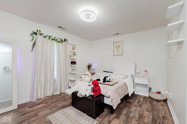 6136 Sandcherry Dr, Indianapolis, IN 46236 - bedroom featuring dark wood-type flooring and a textured ceiling