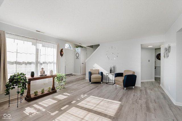 6136 Sandcherry Dr, Indianapolis, IN 46236 - living area featuring light wood-style floors and baseboards