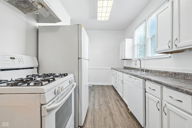 1621 E Kelly St, Indianapolis, IN 46203 - kitchen featuring white appliances, ventilation hood, light wood-style floors, dark countertops, and white cabinets