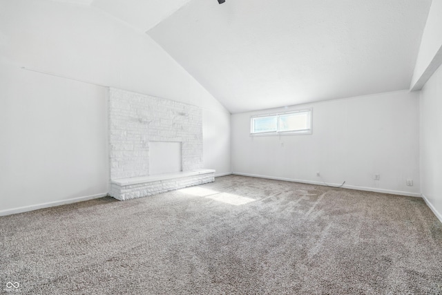 1621 E Kelly St, Indianapolis, IN 46203 - unfurnished living room featuring vaulted ceiling and carpet