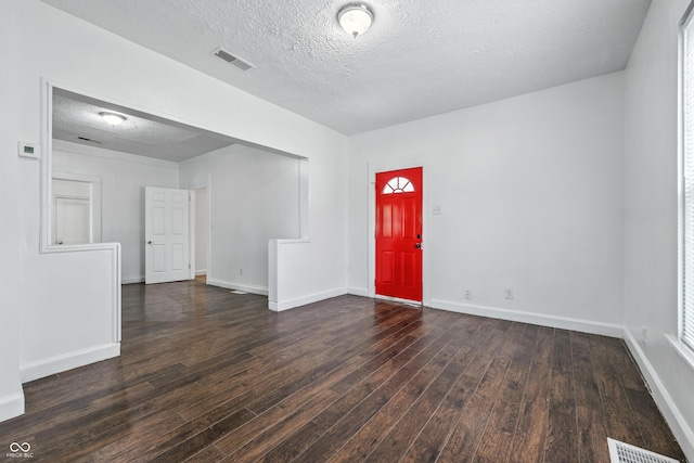 1621 E Kelly St, Indianapolis, IN 46203 - entryway with dark wood-style flooring and a textured ceiling