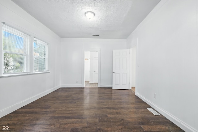 1621 E Kelly St, Indianapolis, IN 46203 - spare room featuring a textured ceiling and wood finished floors