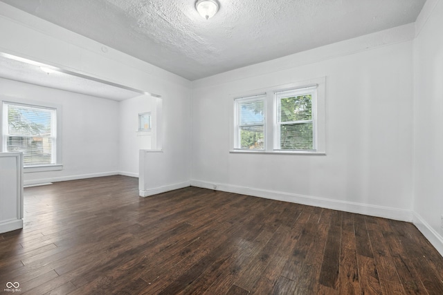 1621 E Kelly St, Indianapolis, IN 46203 - spare room with dark wood-style floors and a textured ceiling