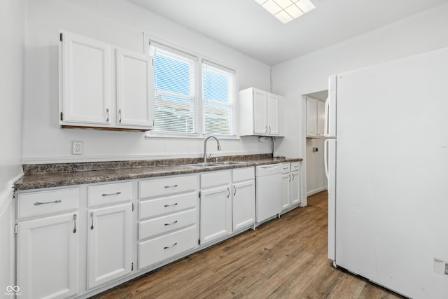 1621 E Kelly St, Indianapolis, IN 46203 - kitchen with white appliances, white cabinets, dark countertops, and wood finished floors