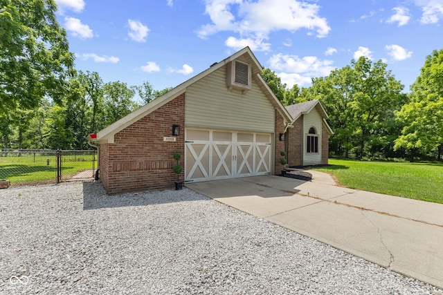 4359 N State Road 75th Hwy, North Salem, IN 46165 - view of front of home with driveway, brick siding, an attached garage, and view of wooded area