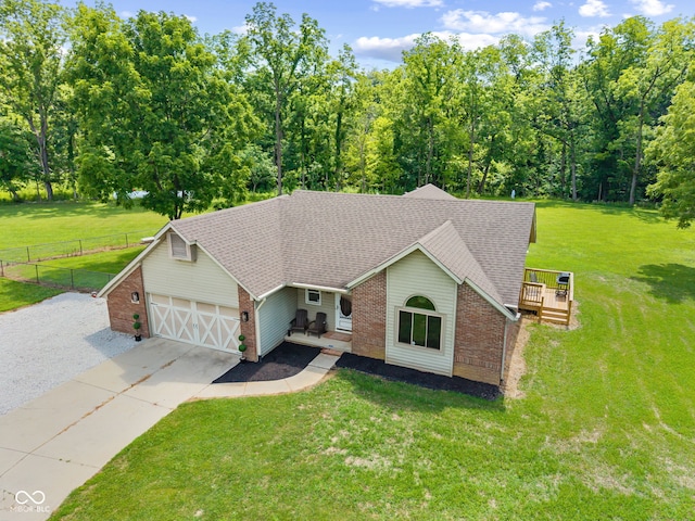 4359 N State Road 75th Hwy, North Salem, IN 46165 - view of front of house with concrete driveway, a shingled roof, an attached garage, and brick siding