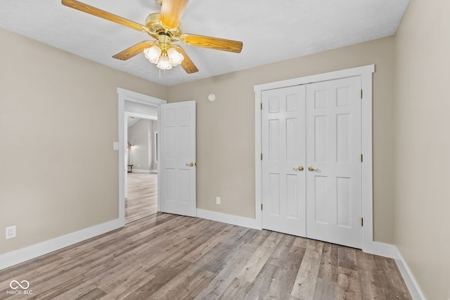 4359 N State Road 75th Hwy, North Salem, IN 46165 - unfurnished bedroom featuring wood finished floors, a closet, and ceiling fan