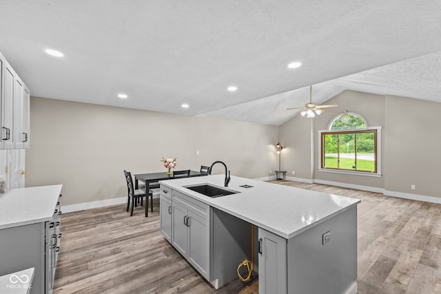 4359 N State Road 75th Hwy, North Salem, IN 46165 - kitchen with a ceiling fan, light wood-style floors, lofted ceiling, light countertops, and an island with sink