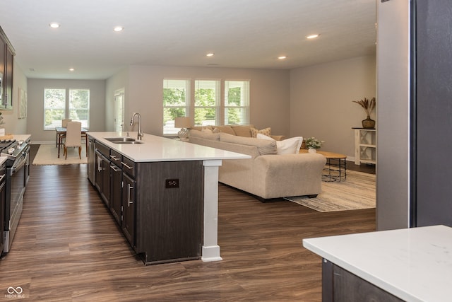 20141 Willenhall Way, Westfield, IN 46074 - kitchen with dark brown cabinetry, recessed lighting, dark wood-type flooring, open floor plan, and light countertops