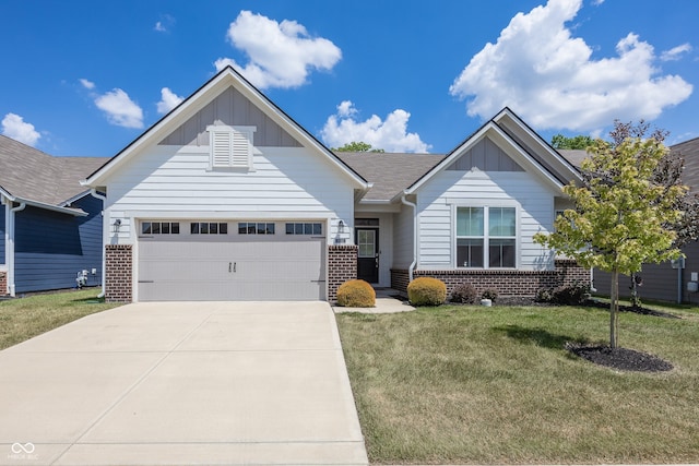 20141 Willenhall Way, Westfield, IN 46074 - view of front of property with board and batten siding, brick siding, driveway, an attached garage, and a front yard