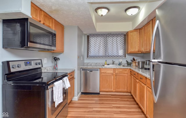 2725 Palo Verde Ct, Indianapolis, IN 46227 - kitchen featuring appliances with stainless steel finishes, light wood-style flooring, and light countertops