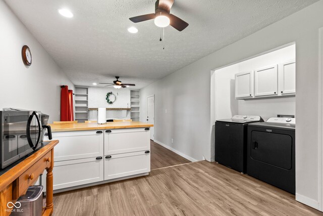 296 Summit Ridge Dr, Greenwood, IN 46142 - kitchen featuring washer and dryer, black microwave, a ceiling fan, butcher block countertops, and a textured ceiling