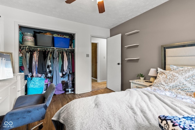 296 Summit Ridge Dr, Greenwood, IN 46142 - bedroom with wood finished floors, a closet, ceiling fan, and a textured ceiling