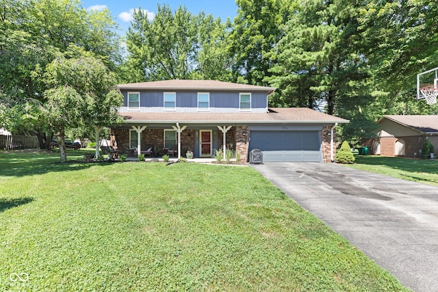 296 Summit Ridge Dr, Greenwood, IN 46142 - traditional home with covered porch, asphalt driveway, a garage, and a front yard