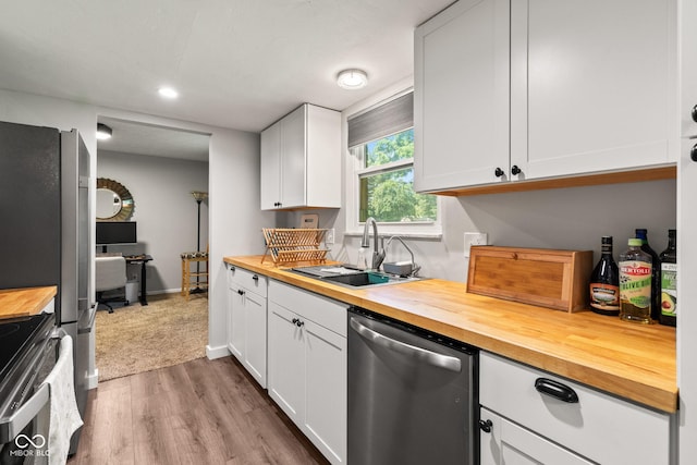 296 Summit Ridge Dr, Greenwood, IN 46142 - kitchen featuring stainless steel appliances, wooden counters, wood finished floors, and recessed lighting