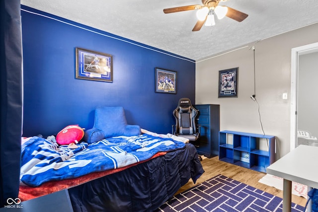 296 Summit Ridge Dr, Greenwood, IN 46142 - bedroom featuring a textured ceiling, wood finished floors, and ceiling fan