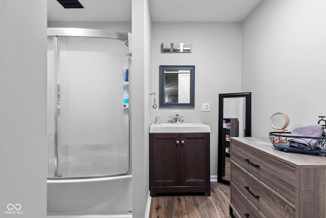 296 Summit Ridge Dr, Greenwood, IN 46142 - bathroom featuring an enclosed shower, wood finished floors, and vanity