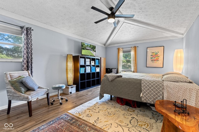 296 Summit Ridge Dr, Greenwood, IN 46142 - bedroom with a textured ceiling, vaulted ceiling, wood finished floors, and ceiling fan