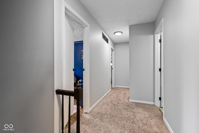 296 Summit Ridge Dr, Greenwood, IN 46142 - corridor featuring carpet flooring and a textured ceiling