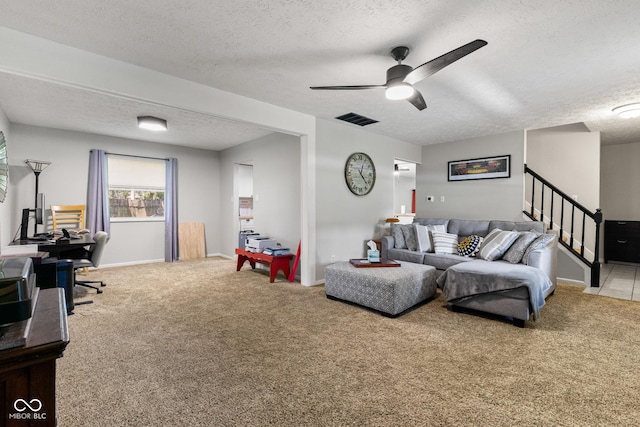 296 Summit Ridge Dr, Greenwood, IN 46142 - carpeted living area with a textured ceiling, ceiling fan, and stairway
