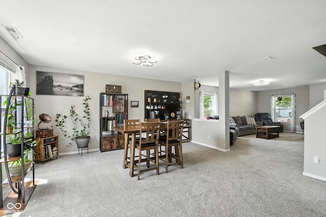 8147 Retreat Ln, Indianapolis, IN 46259 - dining room featuring carpet floors and plenty of natural light