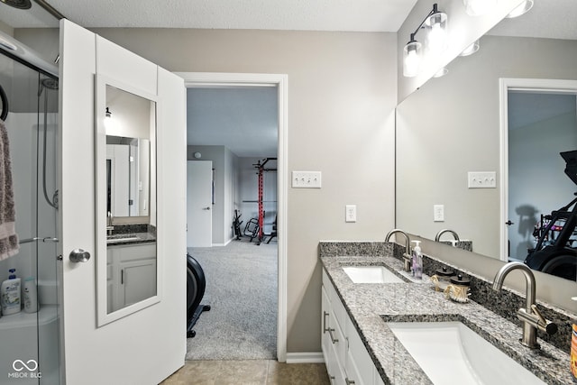 8147 Retreat Ln, Indianapolis, IN 46259 - bathroom featuring double vanity, tile patterned floors, and a shower with door