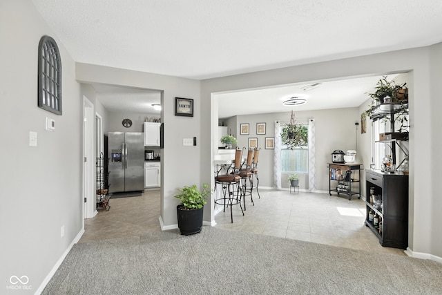 8147 Retreat Ln, Indianapolis, IN 46259 - dining space featuring light tile patterned floors and light colored carpet