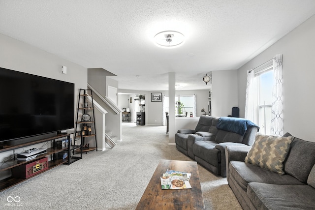 8147 Retreat Ln, Indianapolis, IN 46259 - living room featuring carpet, stairway, and a textured ceiling