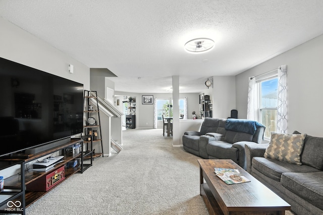 8147 Retreat Ln, Indianapolis, IN 46259 - carpeted living area featuring a textured ceiling and stairs