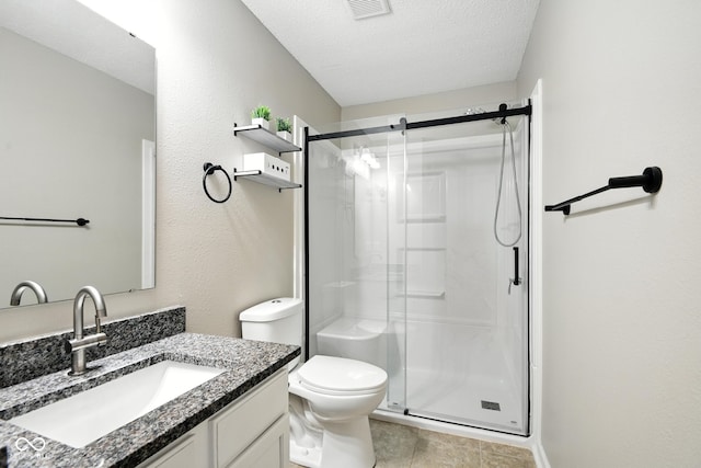 8147 Retreat Ln, Indianapolis, IN 46259 - bathroom featuring a shower stall, vanity, a textured ceiling, and tile patterned flooring