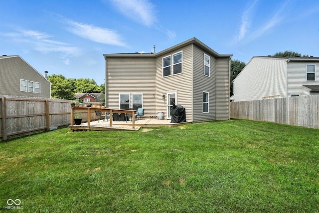 8147 Retreat Ln, Indianapolis, IN 46259 - back of property with a wooden deck and a fenced backyard
