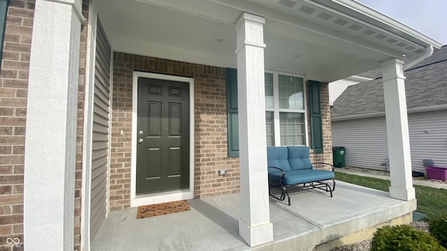 4081 Lotus St, Plainfield, IN 46168 - property entrance featuring covered porch, brick siding, and a shingled roof
