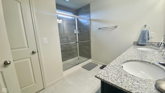 4081 Lotus St, Plainfield, IN 46168 - bathroom with double vanity, a shower stall, and tile patterned floors