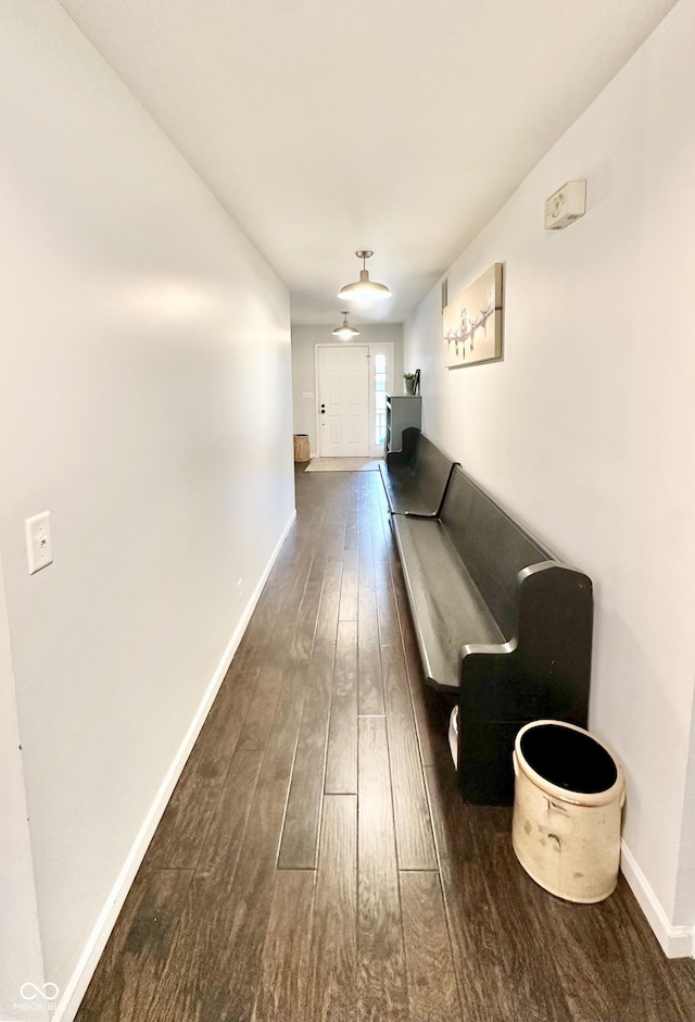 401 Dellwood Dr, Covington, IN 47932 - hallway featuring dark wood-style floors and baseboards