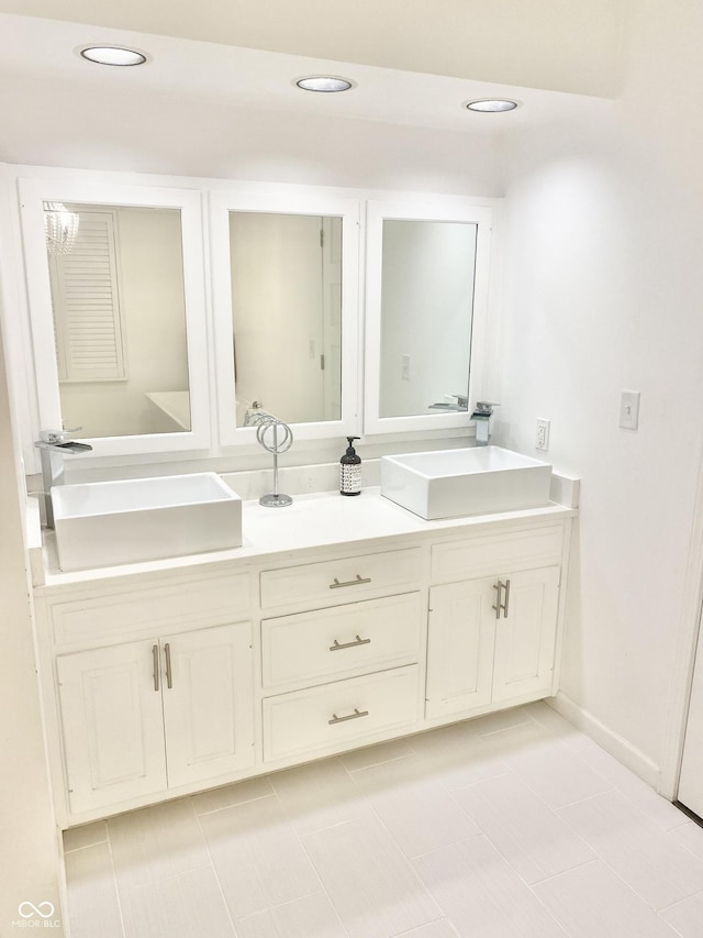 401 Dellwood Dr, Covington, IN 47932 - bathroom featuring double vanity, tile patterned flooring, and recessed lighting