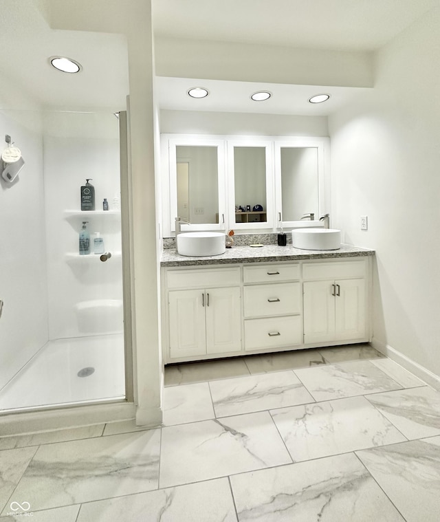 401 Dellwood Dr, Covington, IN 47932 - full bath featuring double vanity, marble finish flooring, a stall shower, and recessed lighting