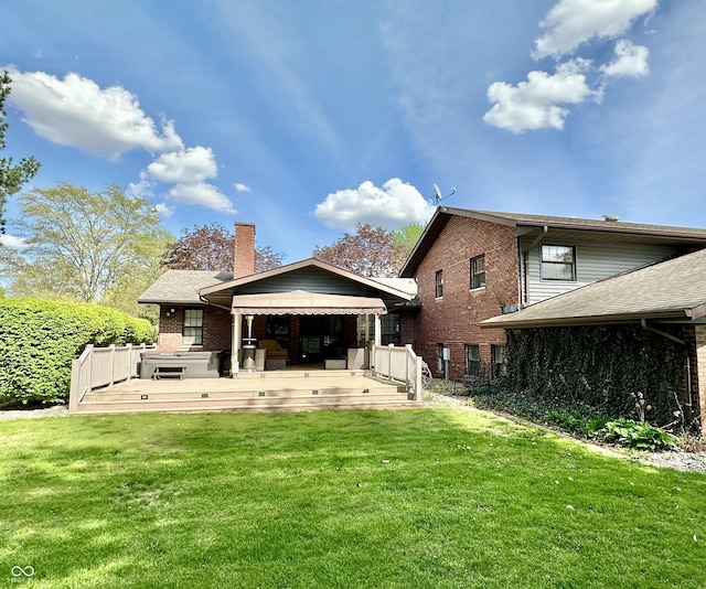 401 Dellwood Dr, Covington, IN 47932 - rear view of house with a chimney, a yard, brick siding, and a deck