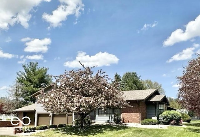 401 Dellwood Dr, Covington, IN 47932 - view of front facade with a front lawn and brick siding