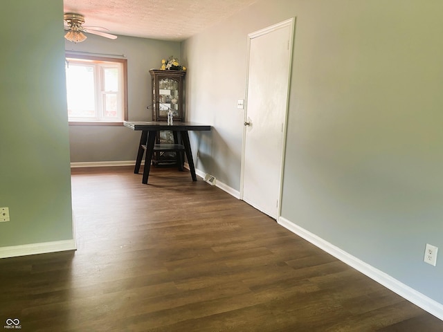 3911 Eastwind St, Indianapolis, IN 46237 - dining space with ceiling fan, dark wood-style flooring, and a textured ceiling