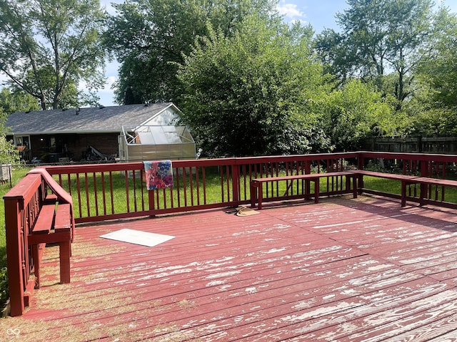 3911 Eastwind St, Indianapolis, IN 46237 - wooden deck with a greenhouse and an outdoor structure