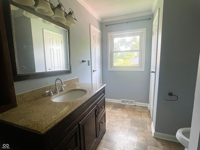 3911 Eastwind St, Indianapolis, IN 46237 - bathroom with stone tile flooring, ornamental molding, and vanity