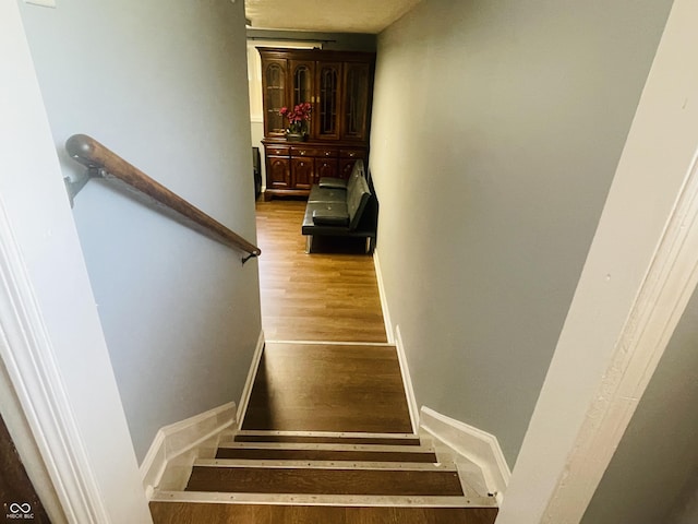 3911 Eastwind St, Indianapolis, IN 46237 - stairway with wood finished floors and baseboards