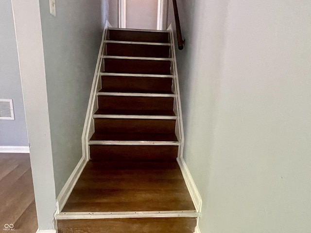 3911 Eastwind St, Indianapolis, IN 46237 - staircase featuring wood finished floors
