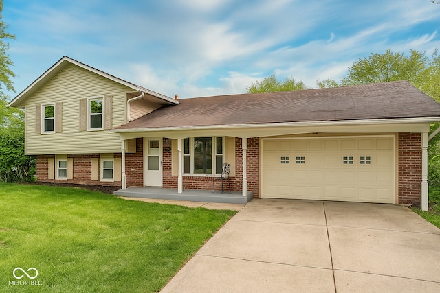 3911 Eastwind St, Indianapolis, IN 46237 - tri-level home with concrete driveway, an attached garage, brick siding, a front yard, and a porch