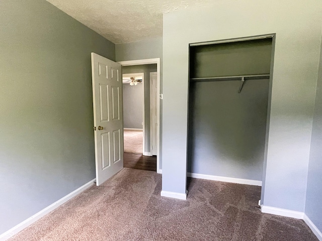 3911 Eastwind St, Indianapolis, IN 46237 - unfurnished bedroom with carpet flooring, a closet, and a textured ceiling