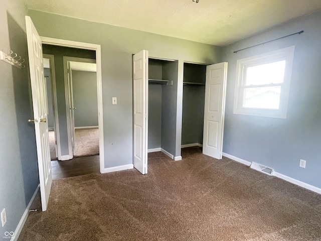 3911 Eastwind St, Indianapolis, IN 46237 - unfurnished bedroom featuring dark colored carpet and a closet