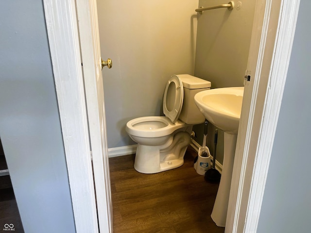 3911 Eastwind St, Indianapolis, IN 46237 - half bath featuring wood finished floors and toilet