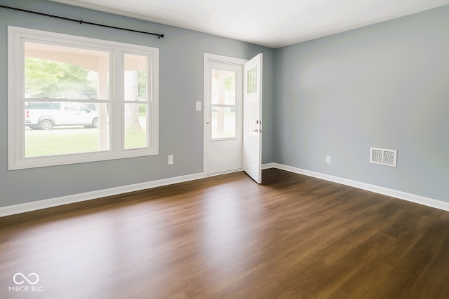 3911 Eastwind St, Indianapolis, IN 46237 - spare room with dark wood-style flooring and baseboards