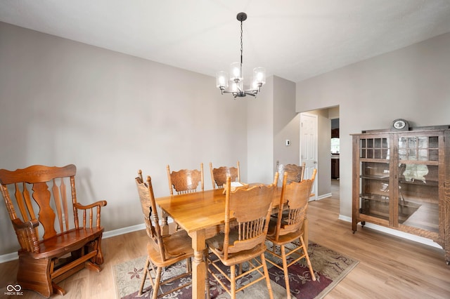 8365 Captain Dr, Avon, IN 46123 - dining area featuring a chandelier and light wood-type flooring