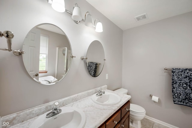 8365 Captain Dr, Avon, IN 46123 - bathroom featuring double vanity and tile patterned flooring